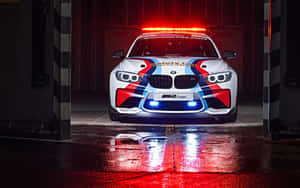 Caption: Safety Car in Action on a Race Track — 16:10 Wallpaper