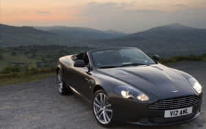 Caption: Makinis na Aston Martin DB9 sa Daan — Steam Deck Wallpaper