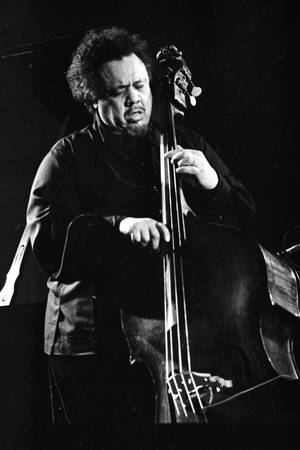 Charles Mingus Soulfully Playing Bass Guitar — Huawei MatePad Edge Wallpaper