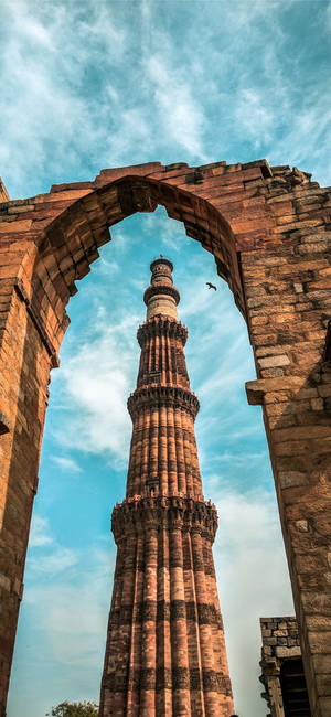 Delhi Qutub Minar arch wallpaper — 1290x2796 Wallpaper