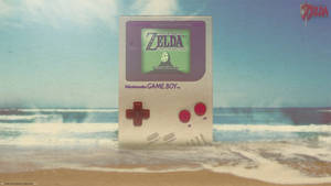 Wallpaper ng Gianteng Nintendo Game Boy sa dalampasigan