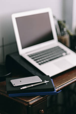 iPhone Desk Workplace With Journals — MacBook Wallpaper