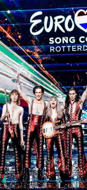Maneskin standing on stage wallpaper — iPhone 16 Wallpaper