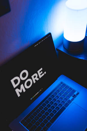 Motivational words on MacBook screen wallpaper