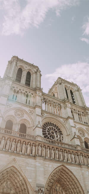 Notre Dame Cathedral Front Architecture — iPhone 16 Pro Wallpaper