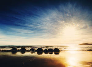 Moeraki Boulders Beach pagsikat ng araw wallpaper