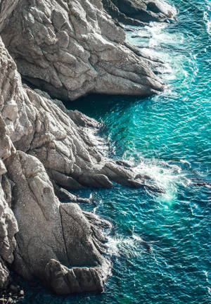 Rock structure and waves wallpaper — OnePlus Pad 3 Wallpaper