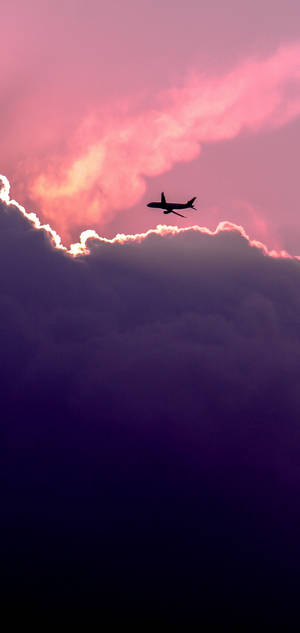 S10 Pink Sky Airplane Silhouette wallpaper. — iPhone Air Wallpaper