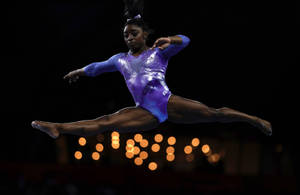 Simon Biles Splitting Midair wallpaper
