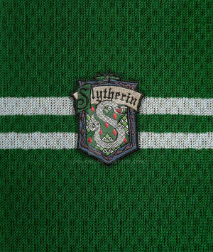 Logo ng Slytherin na niniting na tela na wallpaper — Slytherin estetiko Wallpaper