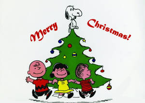 Snoopy sa Tuktok ng Puno ng Pasko na Wallpaper — Snoopy pasko Wallpaper