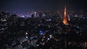 Aerial view wallpaper of Tokyo Tower in the city at night